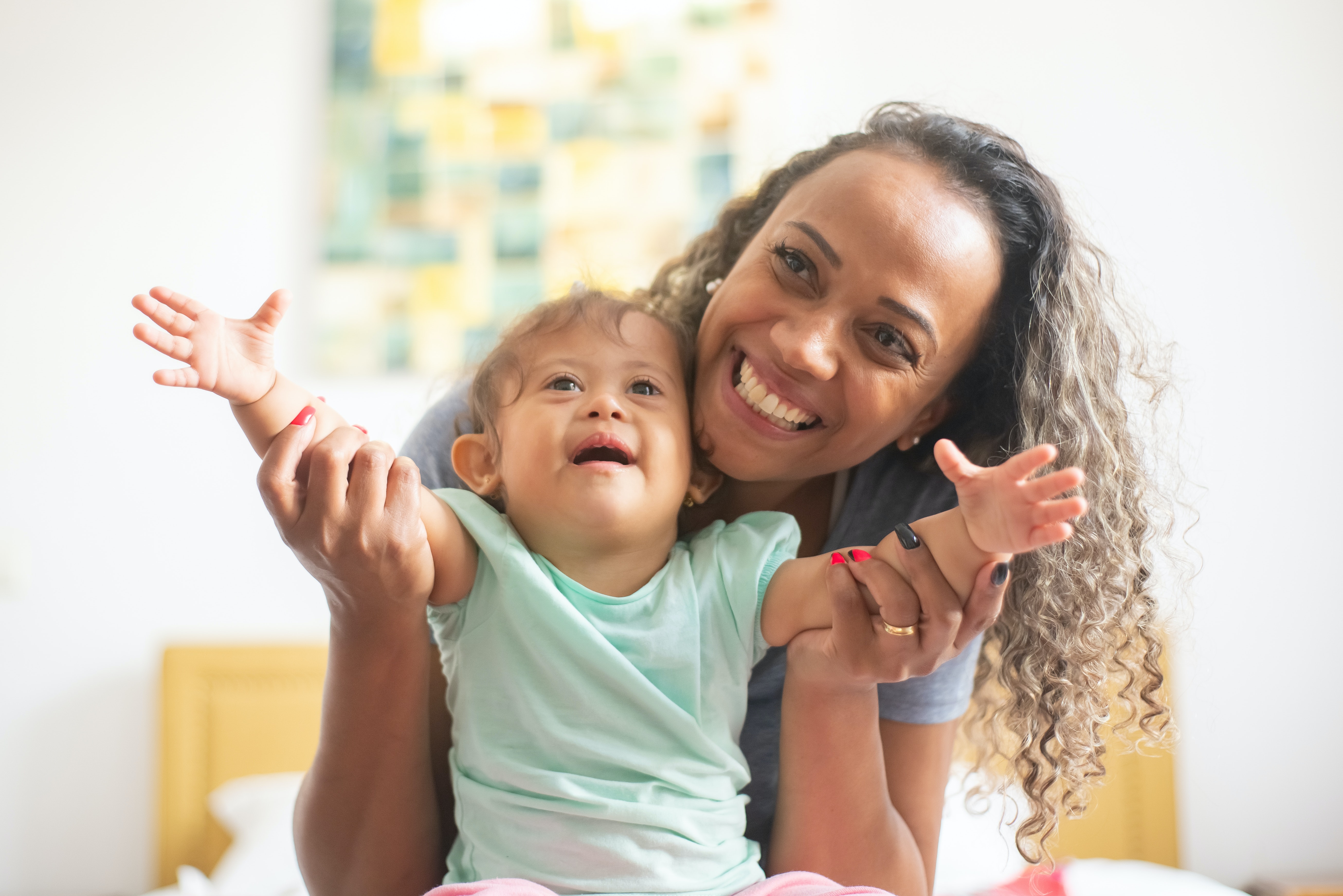 mother smiling with her toddler