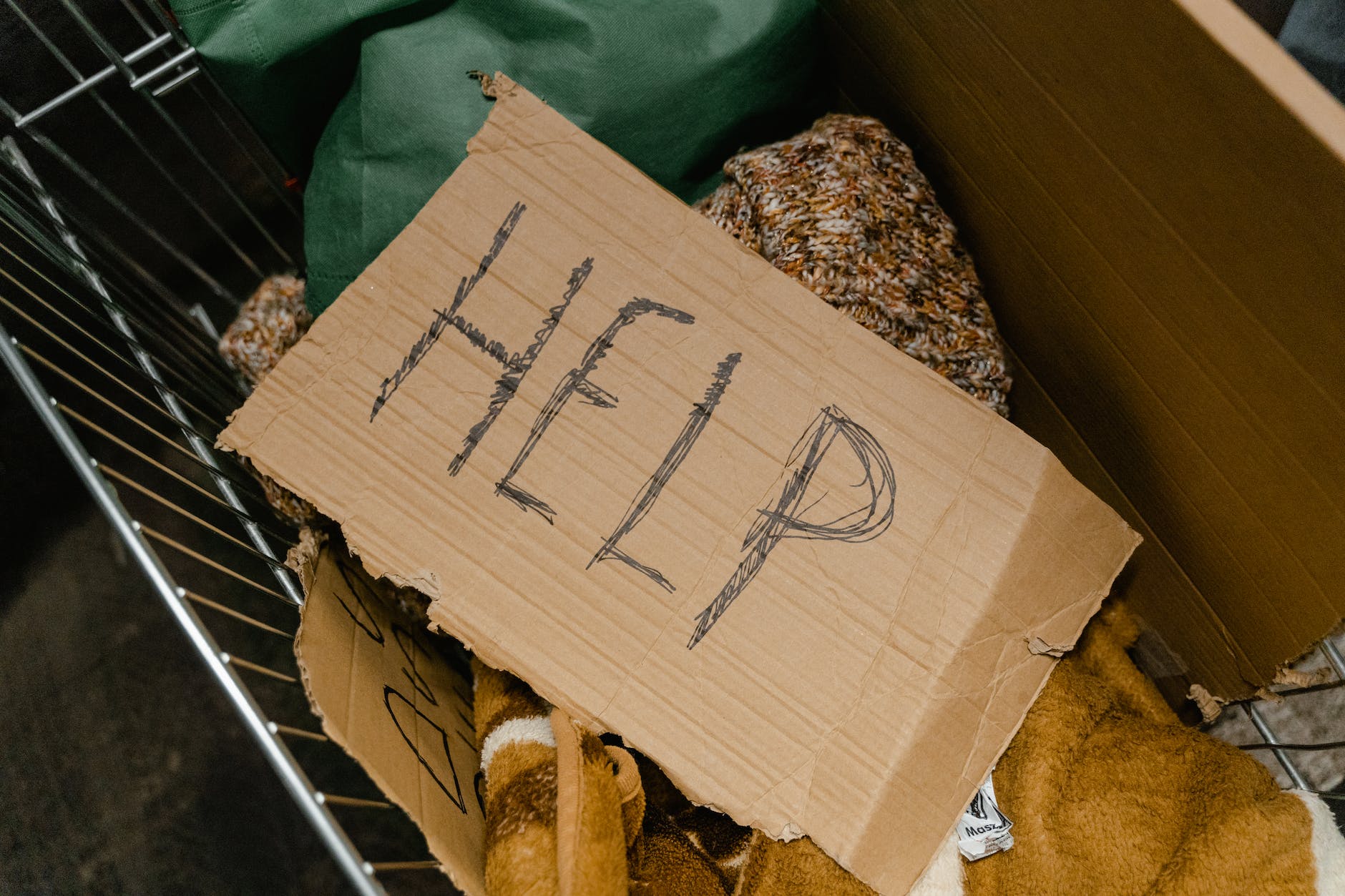 grocery cart with a homeless person's belongings